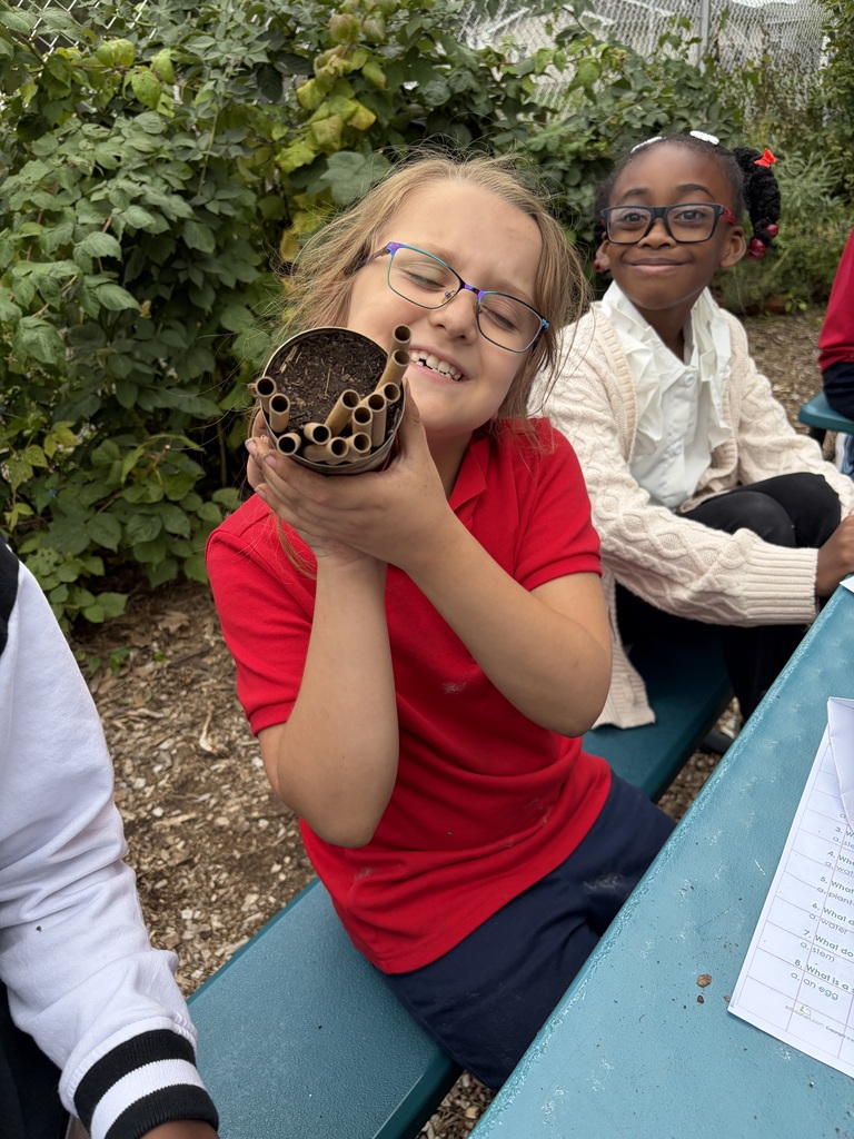 Student holding a solitary bee home.