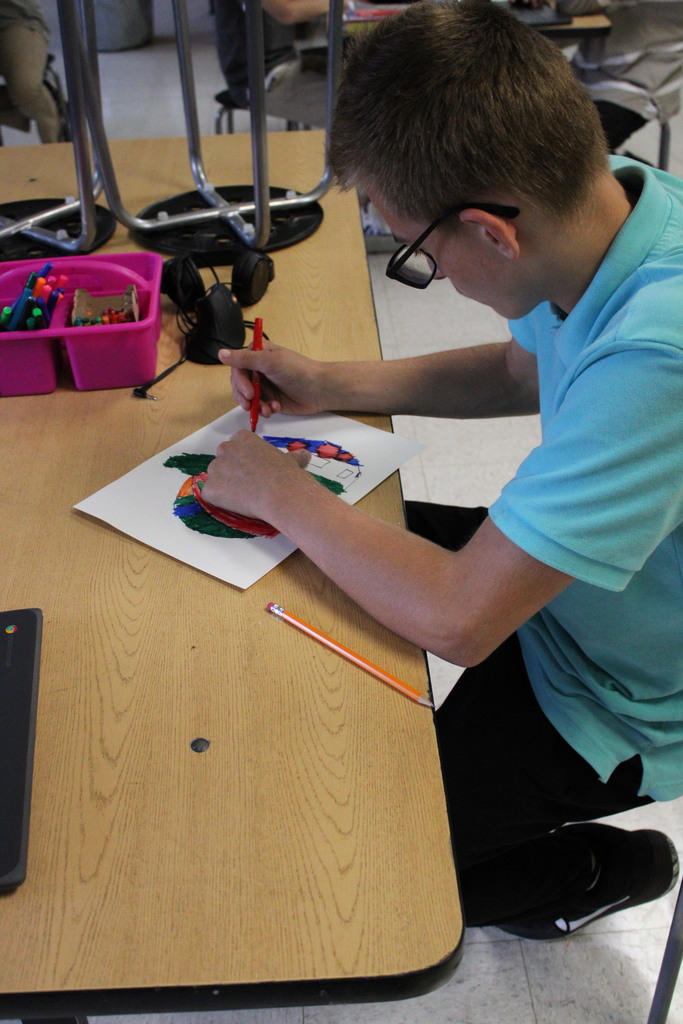male student coloring
