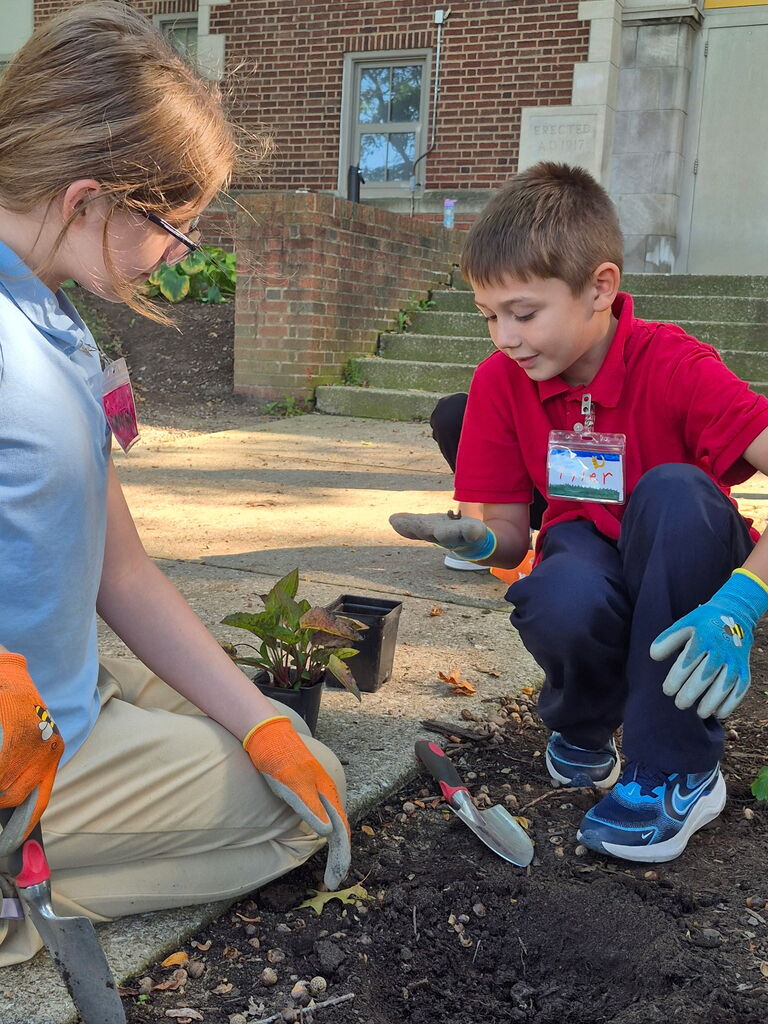 Students planting a garden