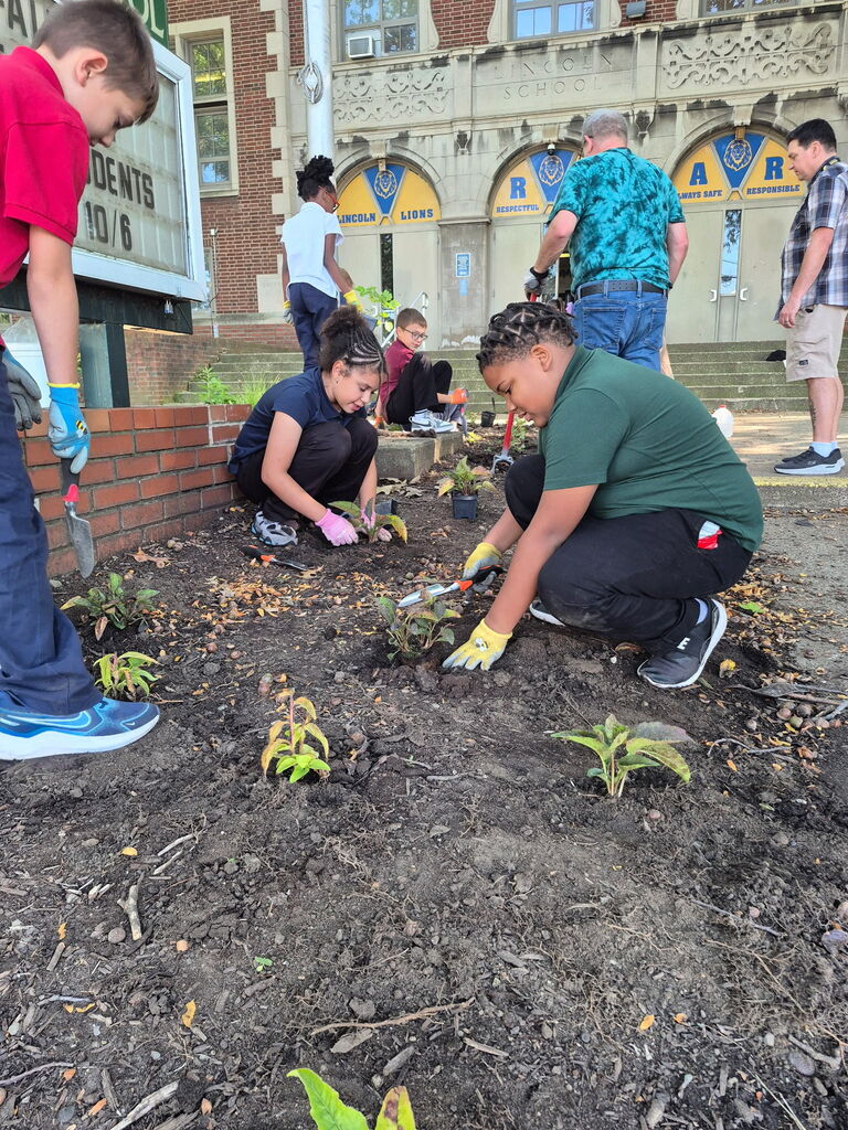 Students planting a garden