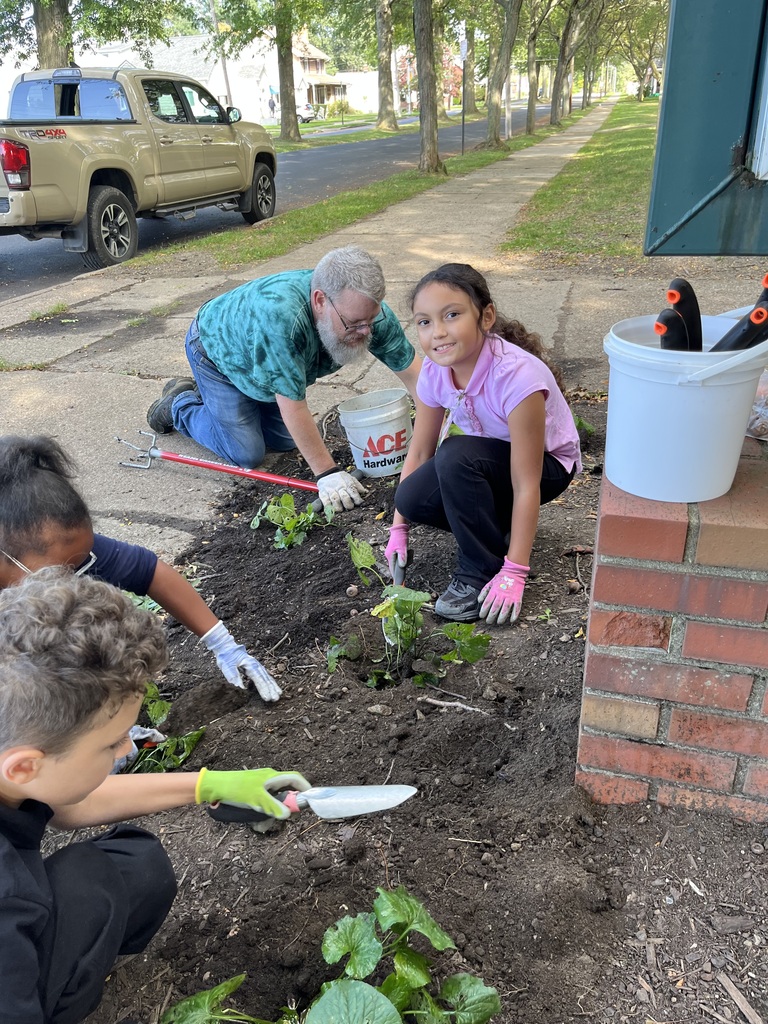 Students planting a garden