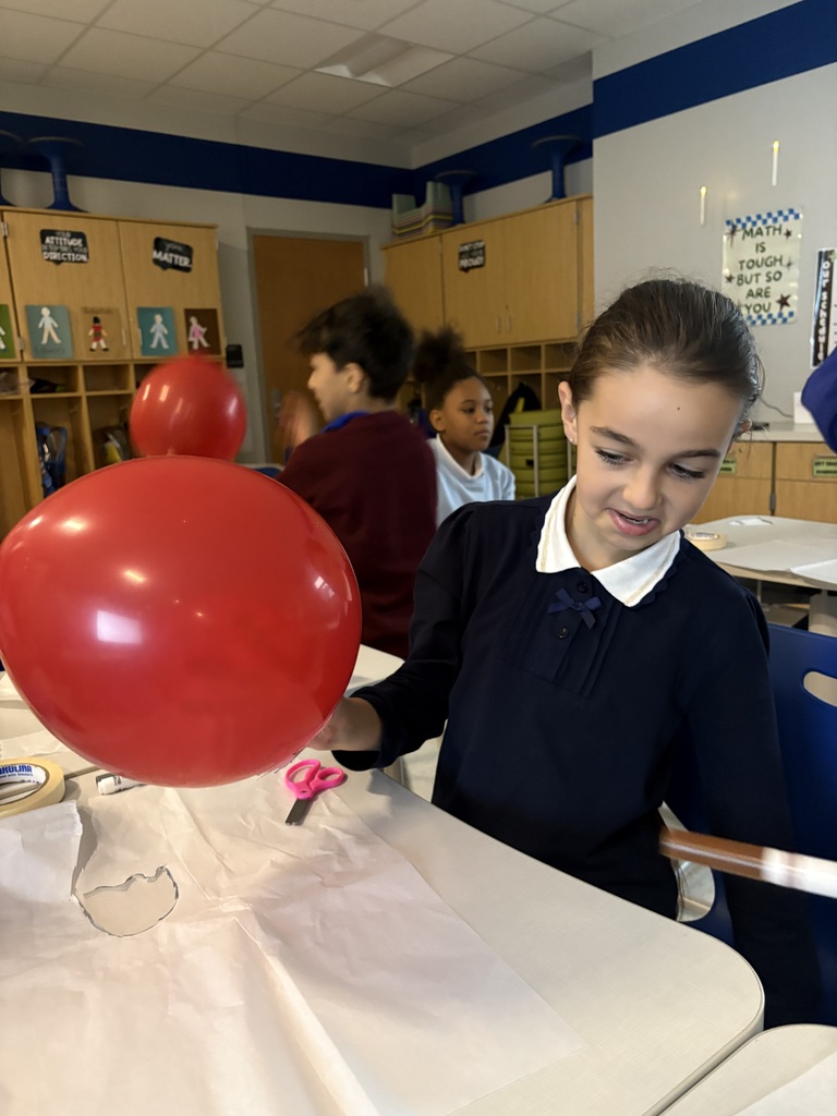 Student holding a balloon