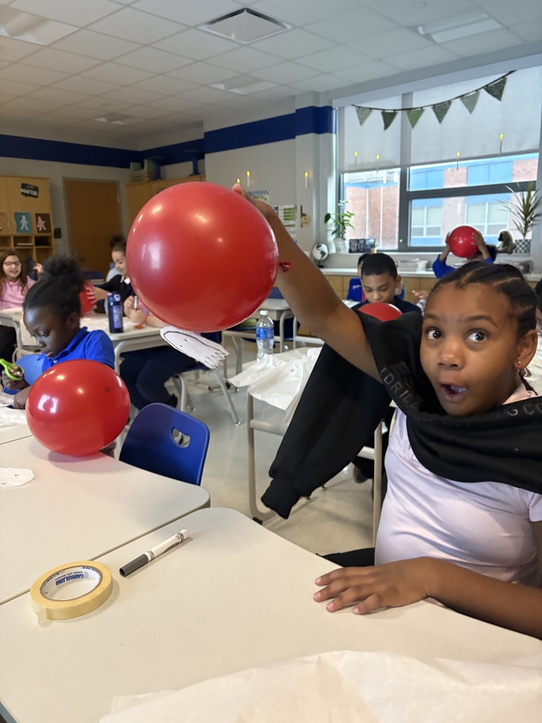 Student holding a balloon