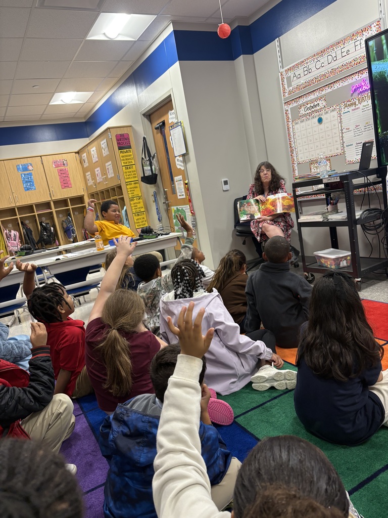 Volunteer reading to students