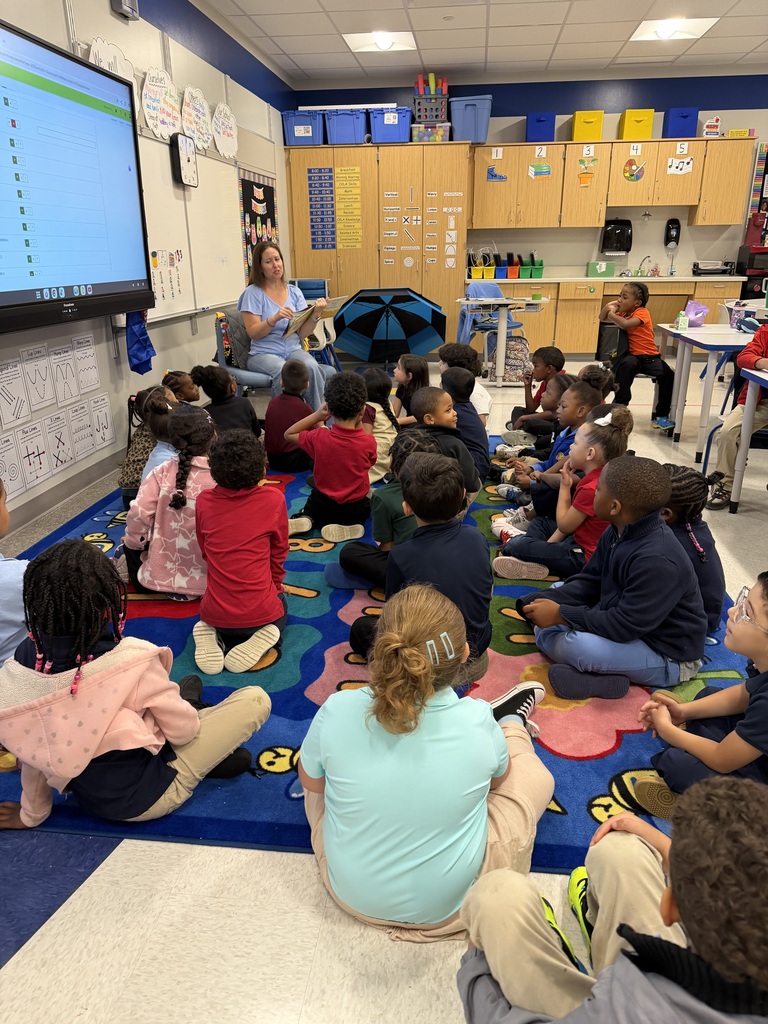 Volunteer reading to students