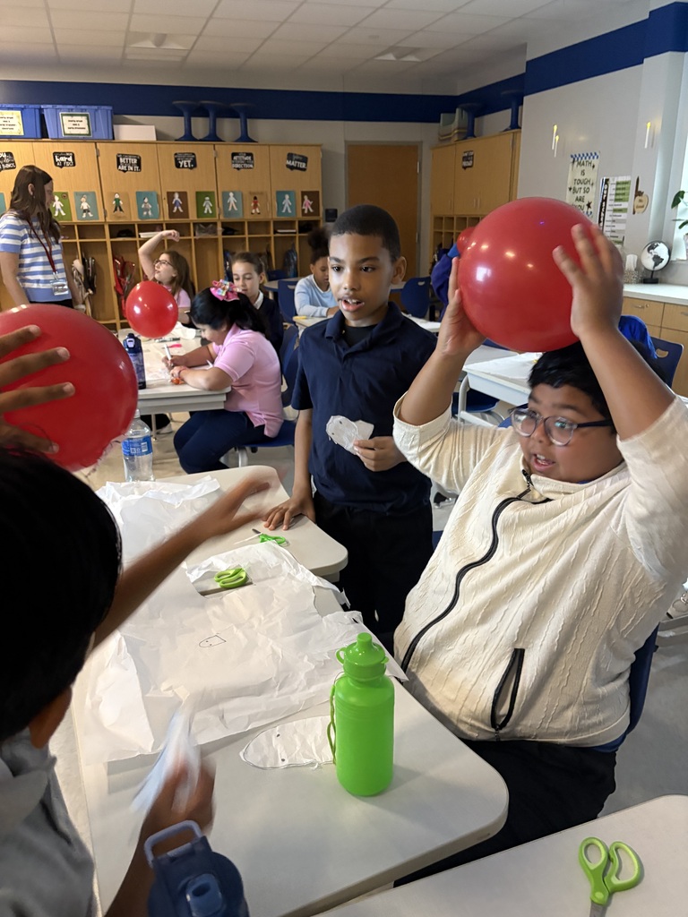 Student holding a balloon