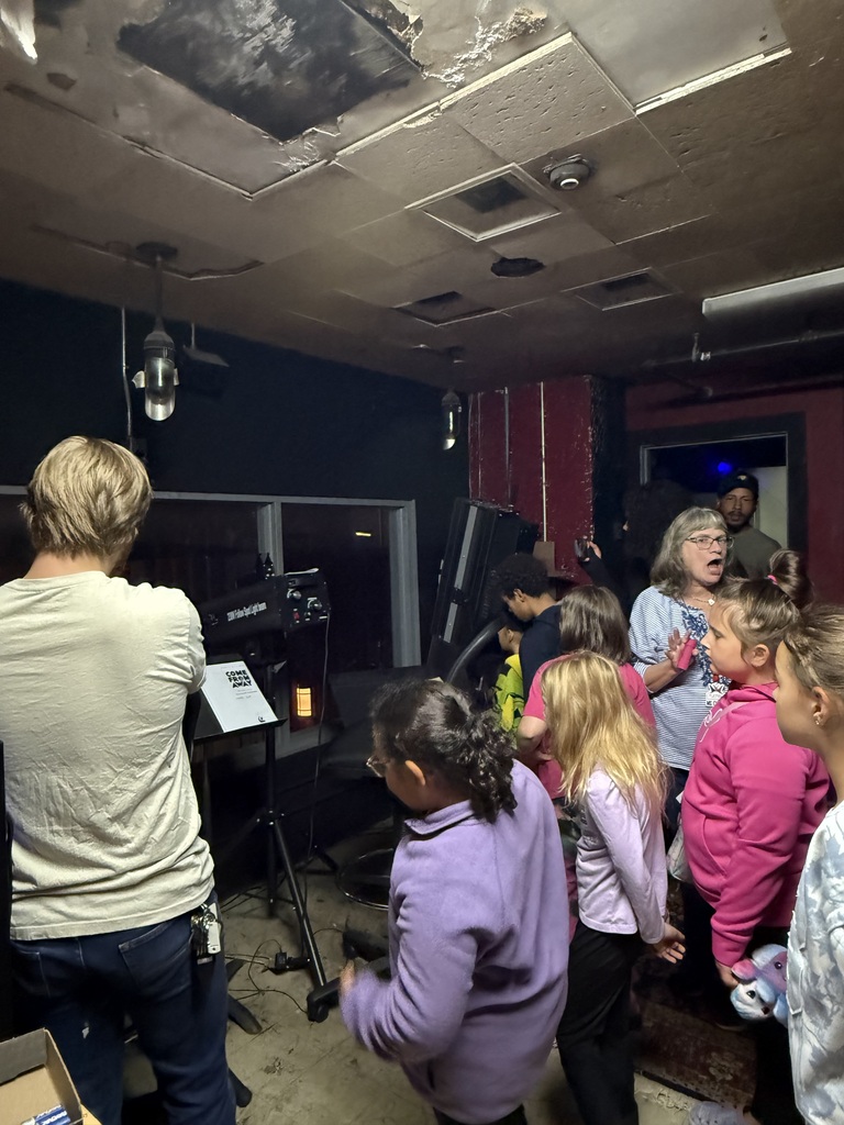 Families taking a tour of the Playhouse 