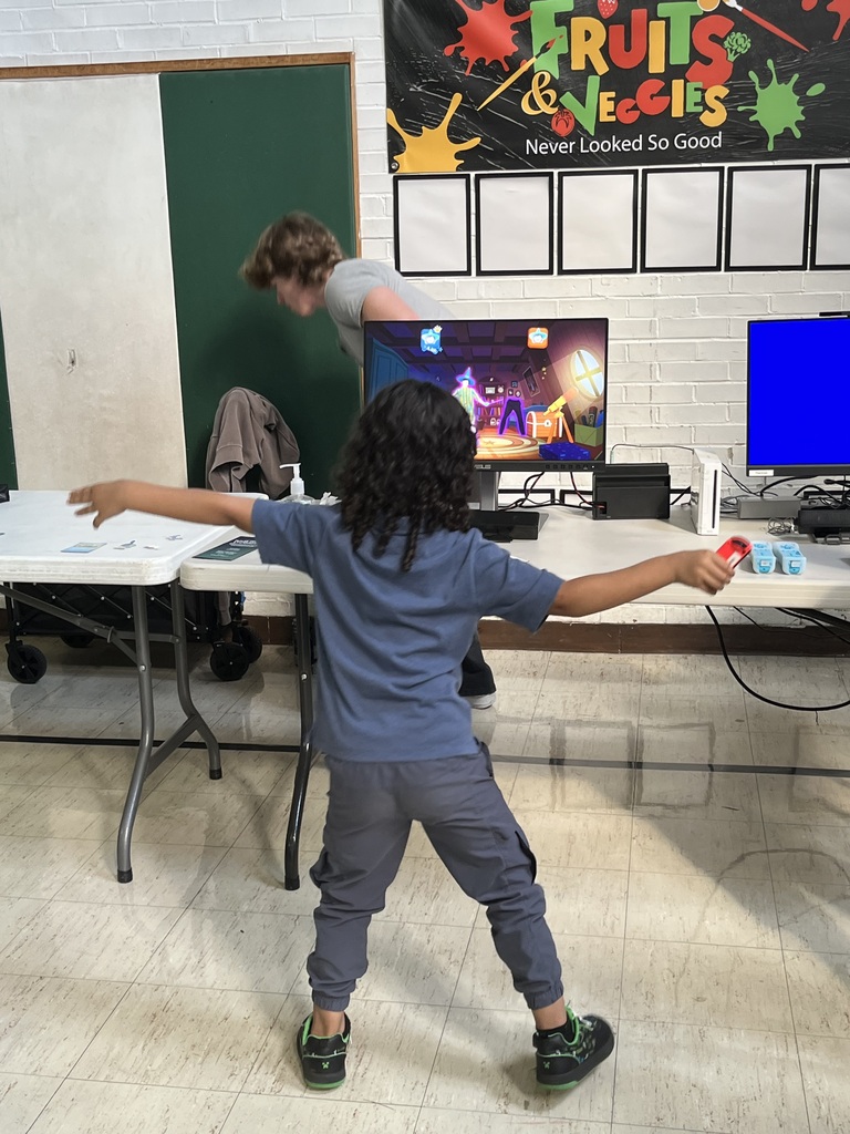 Student playing dance dance revolution