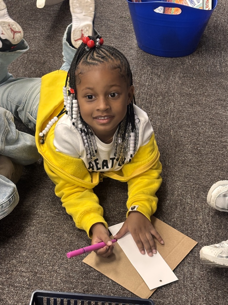 Student coloring a bookmark