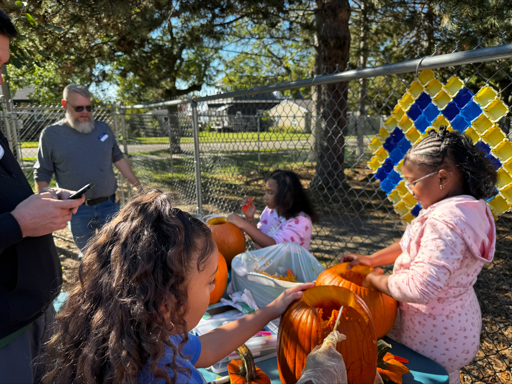 Students carving pumpkins