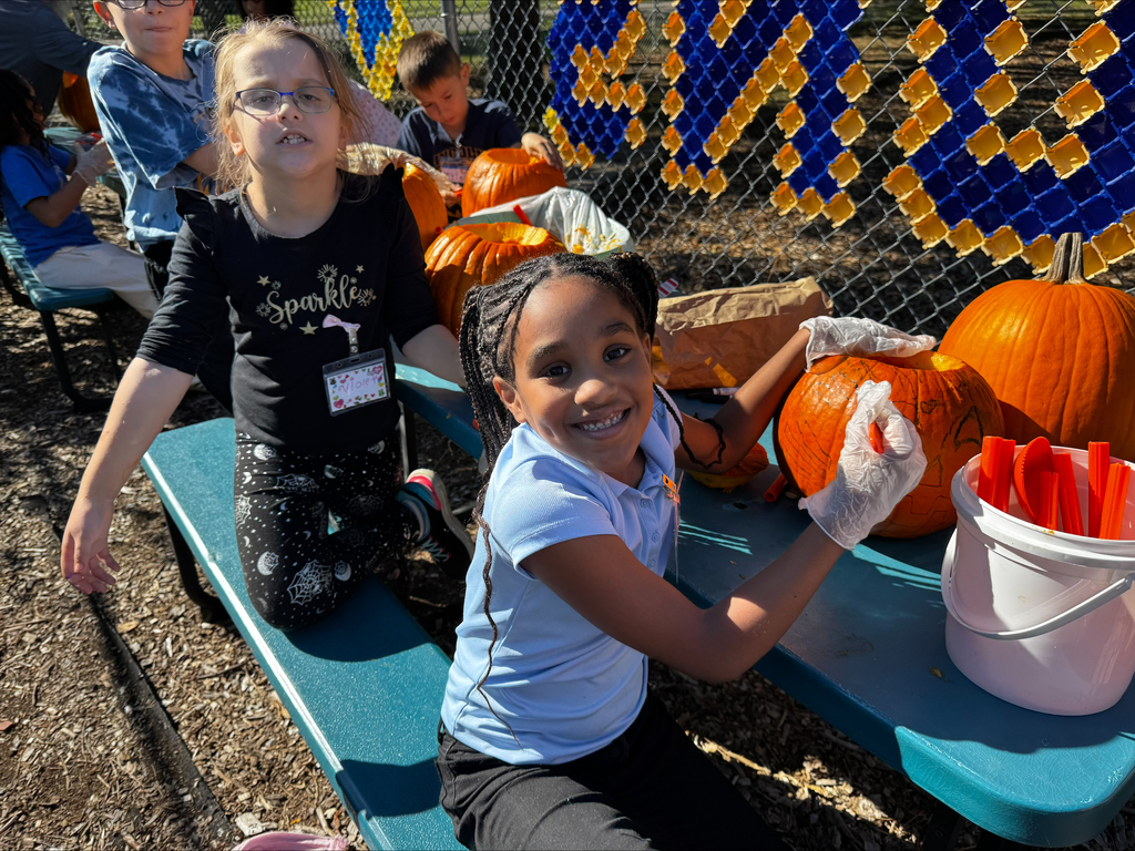 Students carving pumpkins