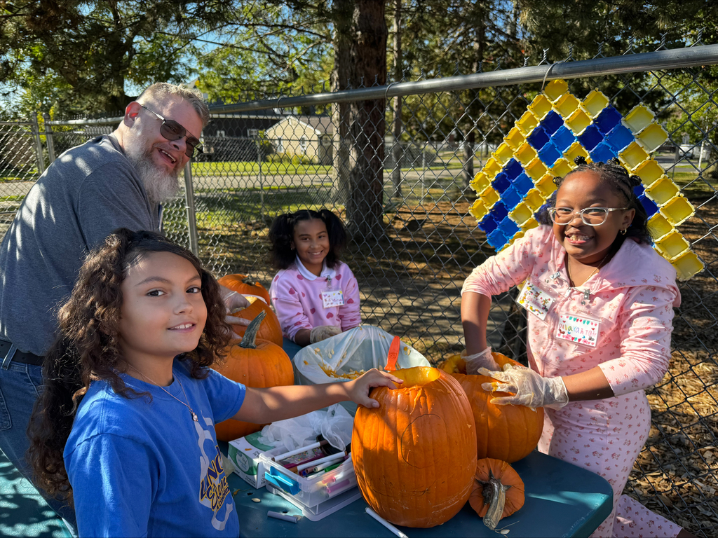 Students carving pumpkins
