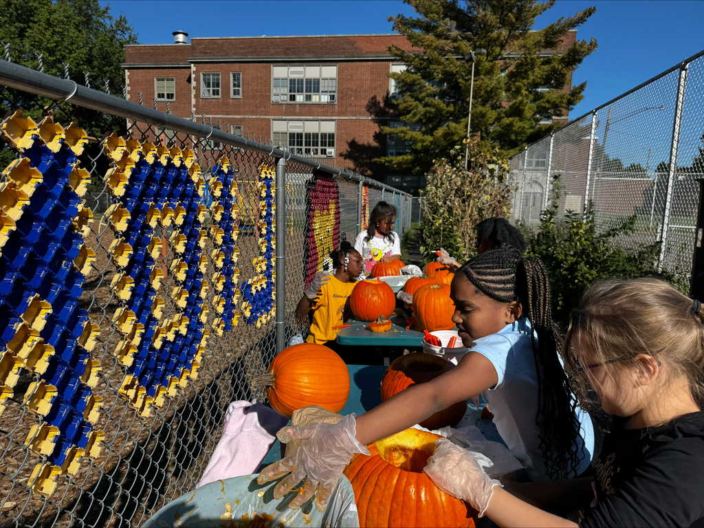 Students carving pumpkins