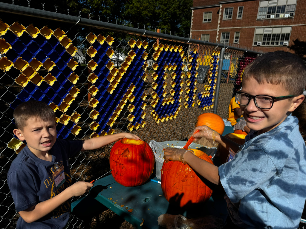 Students carving pumpkins