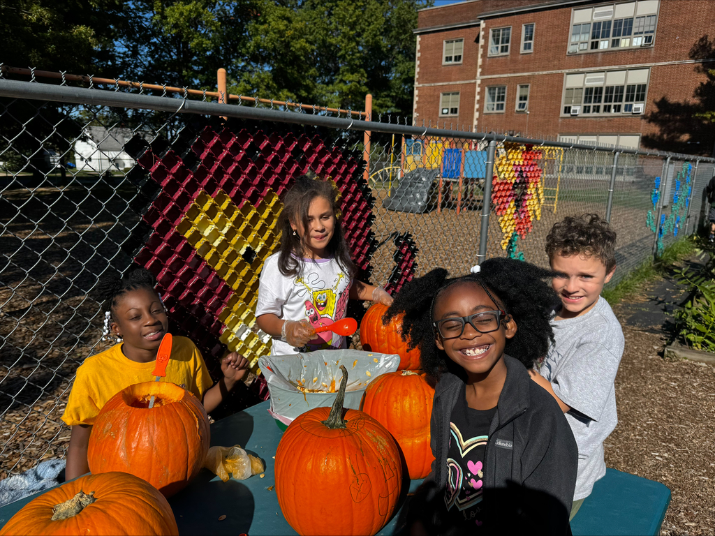 Students carving pumpkins