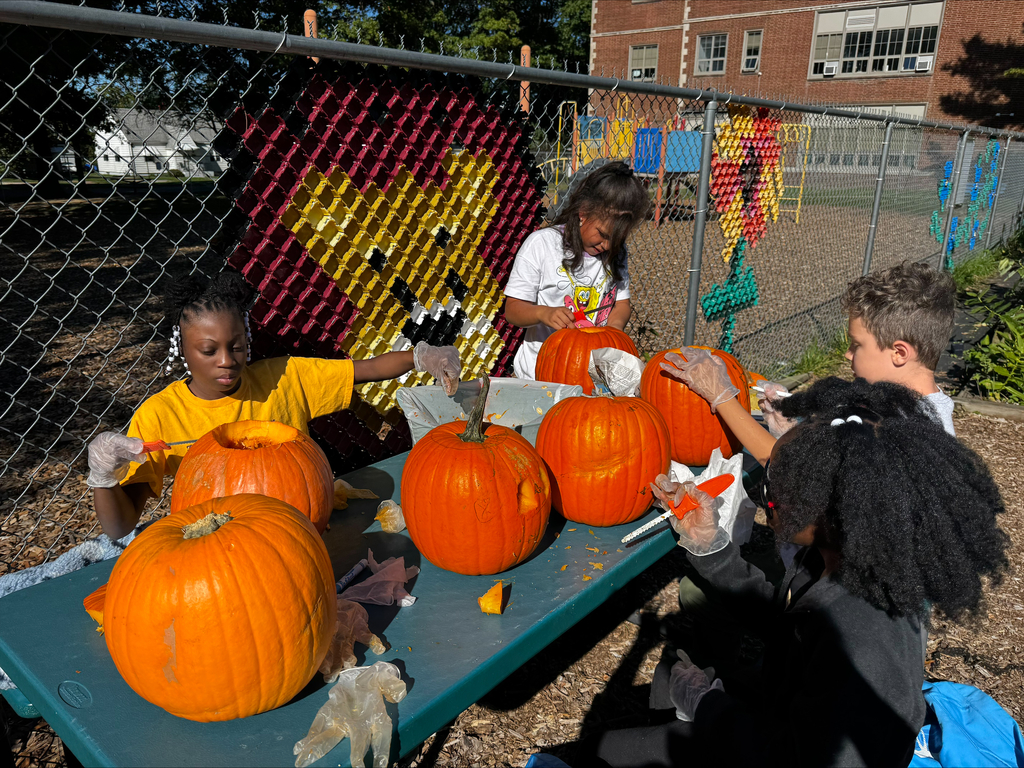 Students carving pumpkins