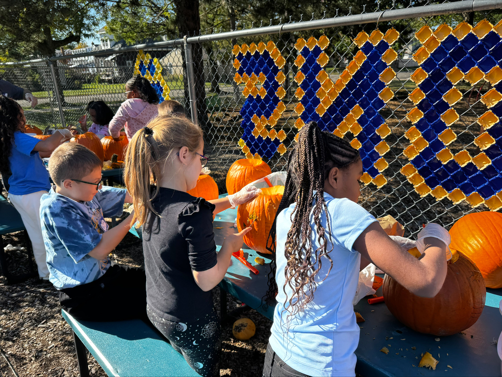 Students carving pumpkins