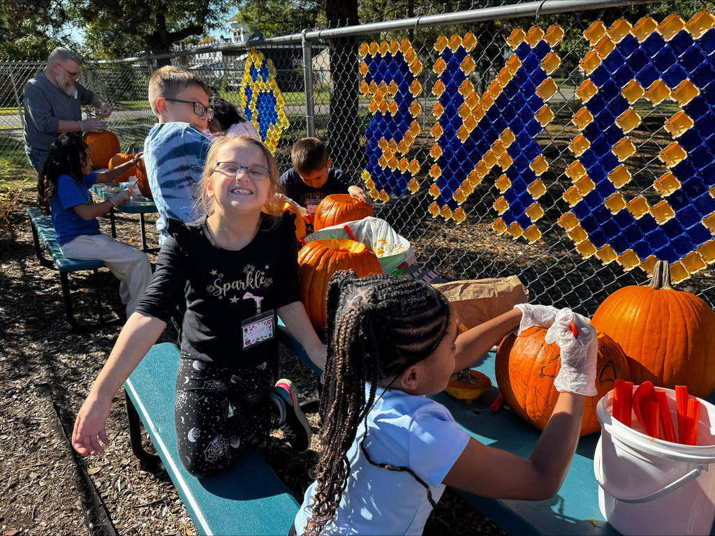 Students carving pumpkins
