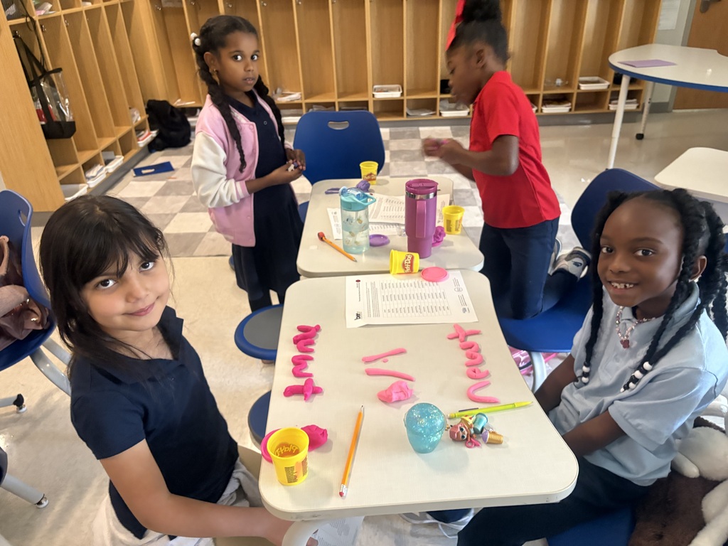 Students using play-doh to spell out words.