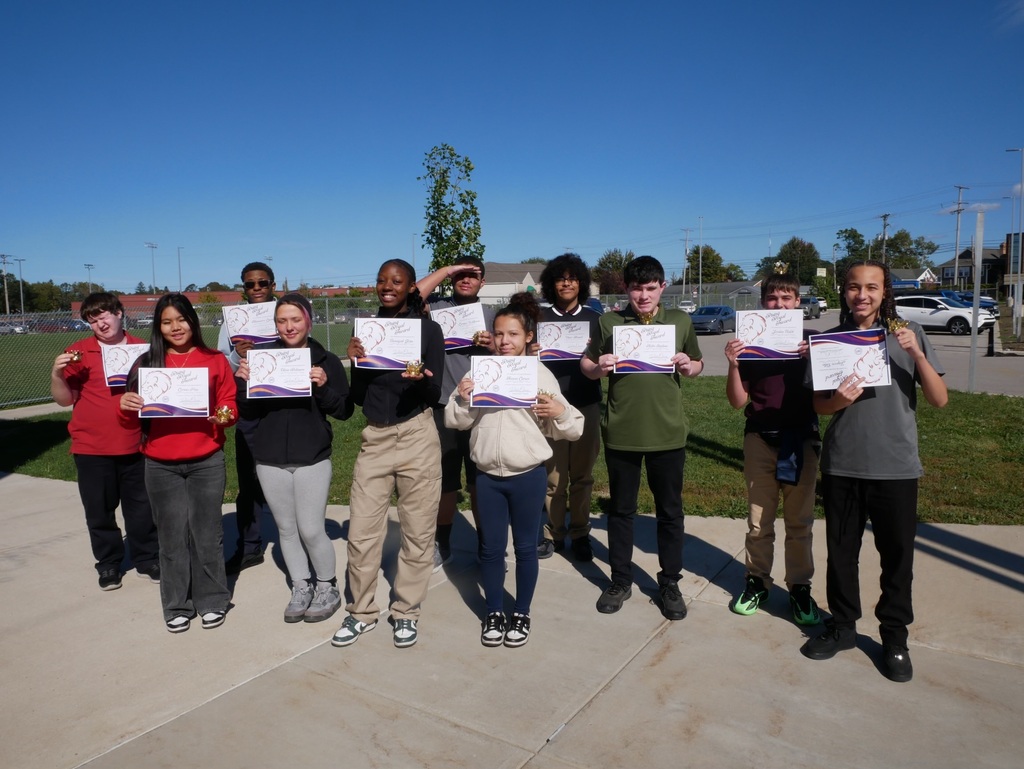 Photo of Erie High students holding up their certificates.