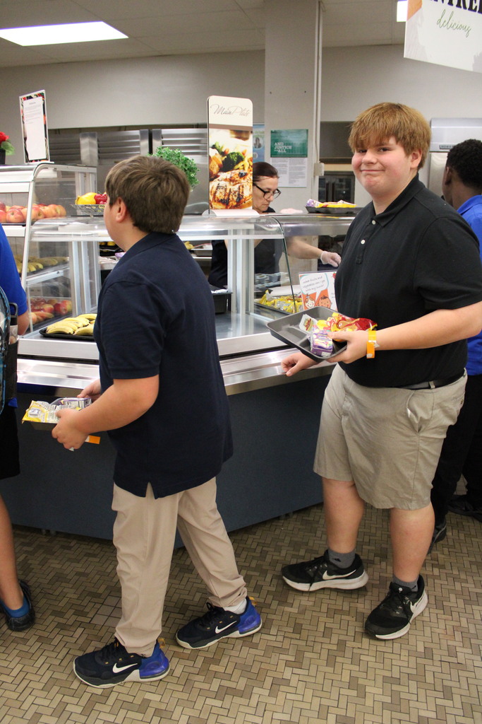 student in line holding a tray