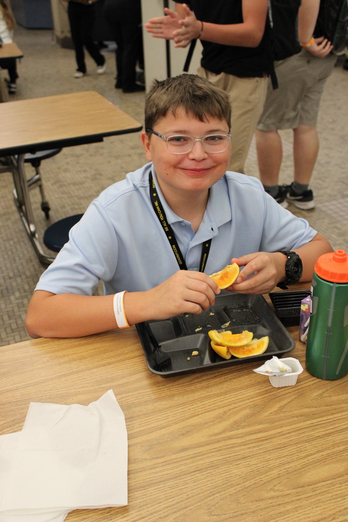 student eating oranges