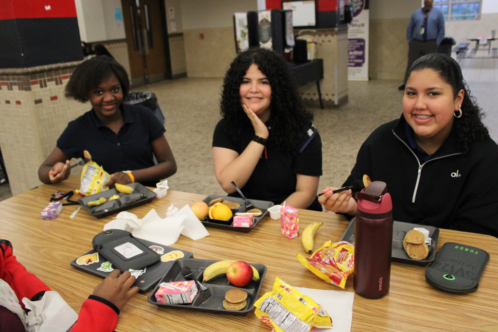 students at a table eating