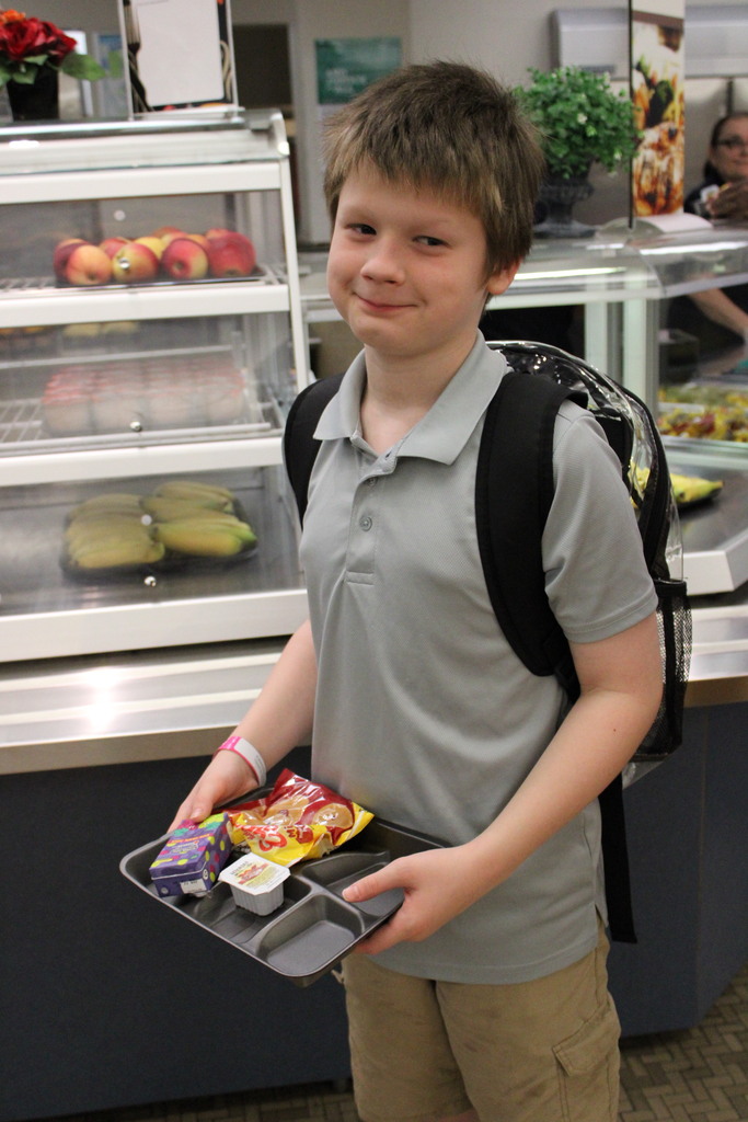 male student with tray