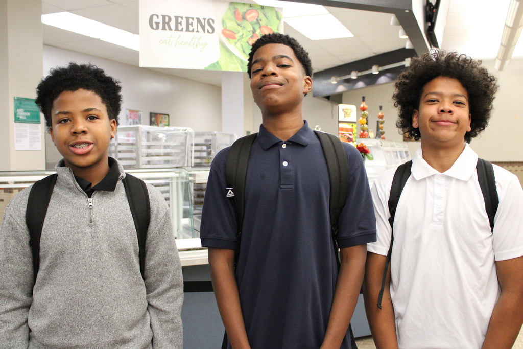 3 students waiting in line