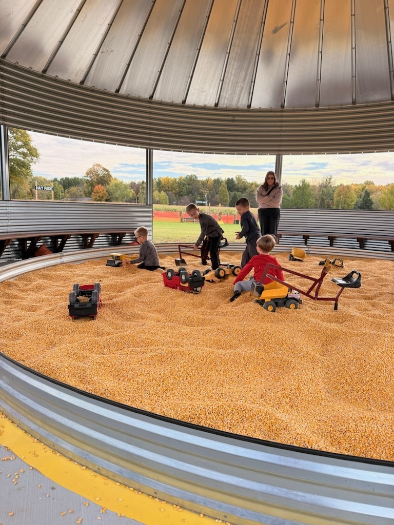 Kids playing in the corn pit