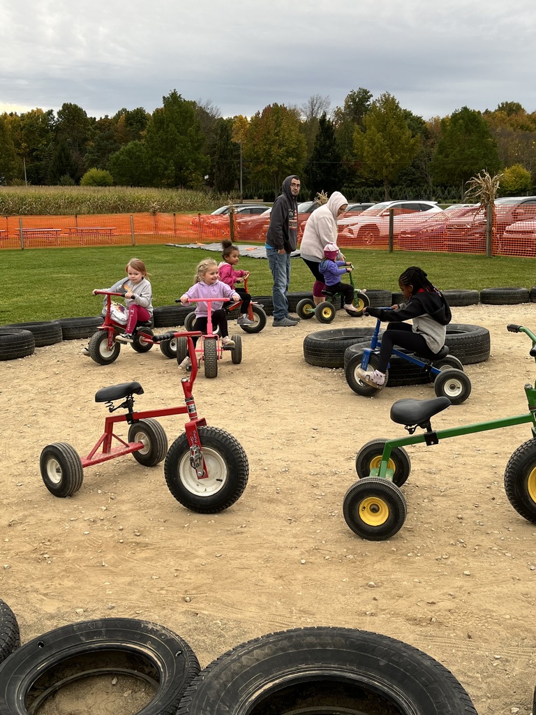 Riding the little pedal tractors