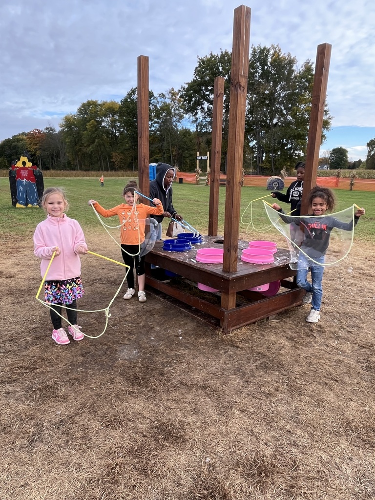 Kids creating giant bubbles