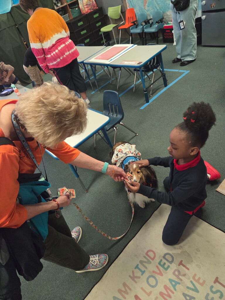 Student petting a therapy dog