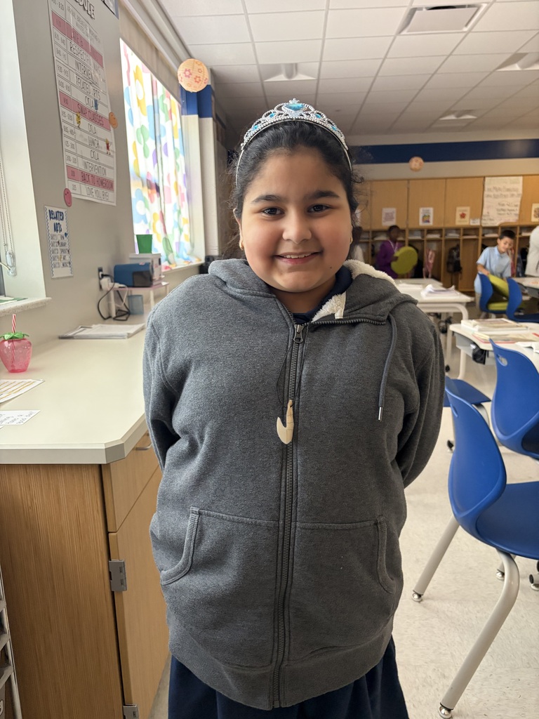 Female student wearing a crown.