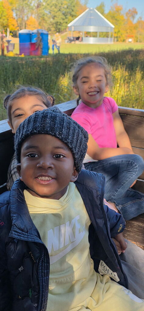 Students smiling on the tractor ride.