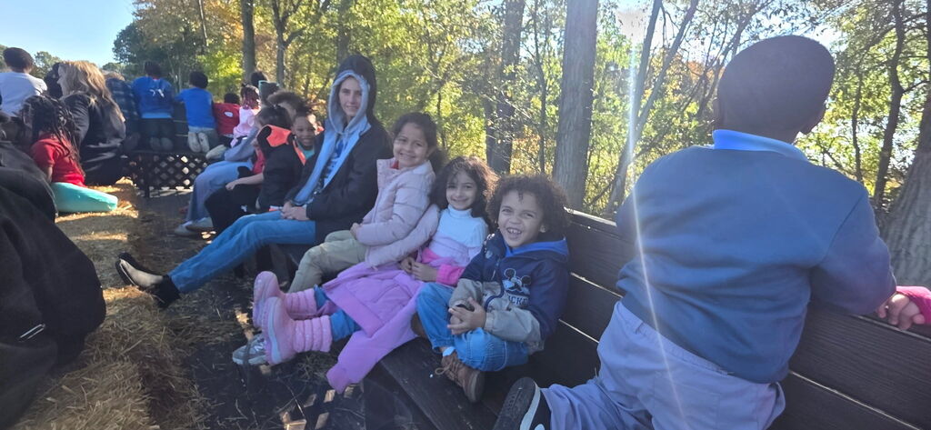 Students smiling on the tractor ride