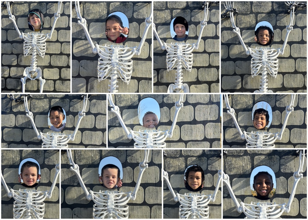 Students posing in skeleton cut outs.