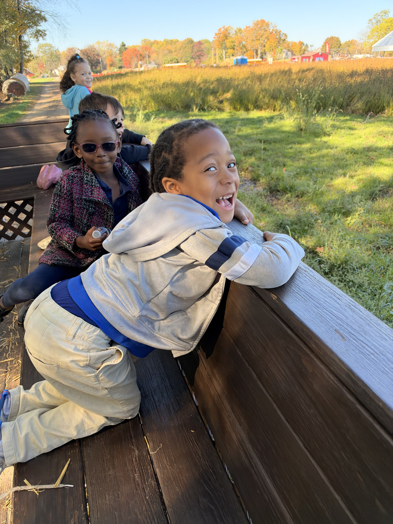 Students smiling on the tractor ride.