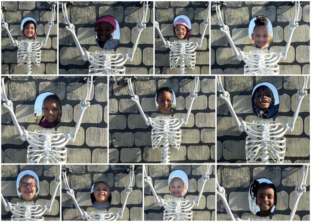 Students posing in skeleton cut outs.