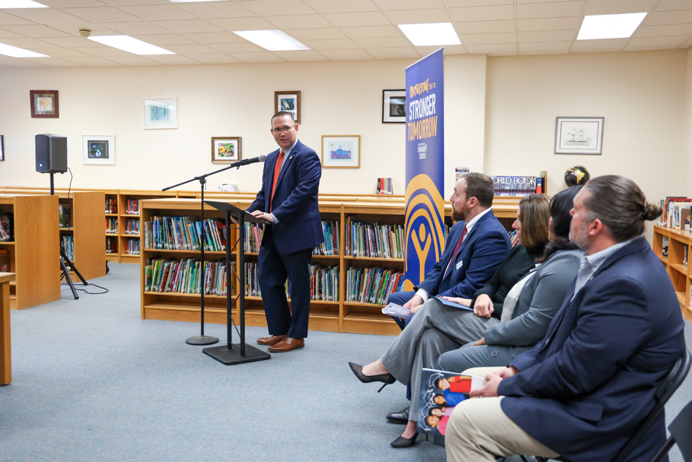 Supervisor of School and Community Safety, Matt Parker giving a speech at a podium.
