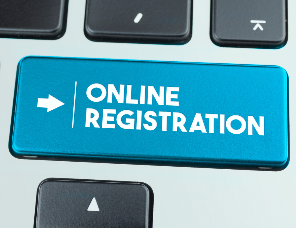 Online registration button on a keyboard.