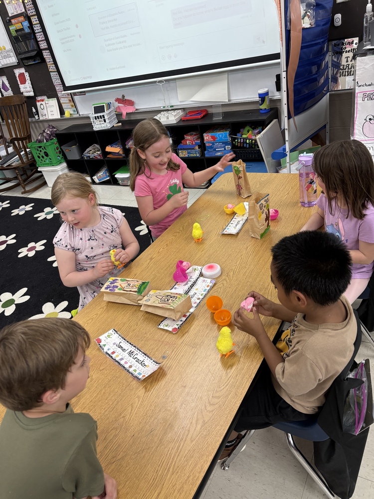 Kids playing with chicks.