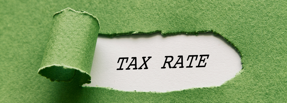 Green background with the word 'tax rate' showing through.