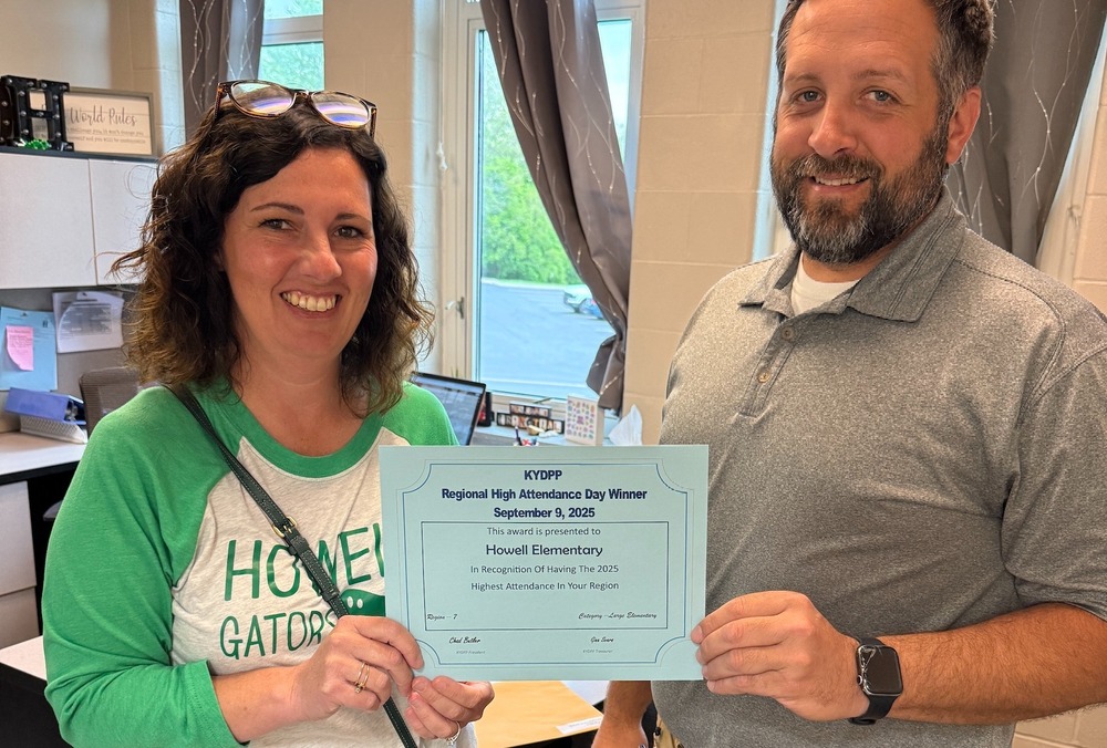 Ms. Gruen and Mr. Haire with certificate.