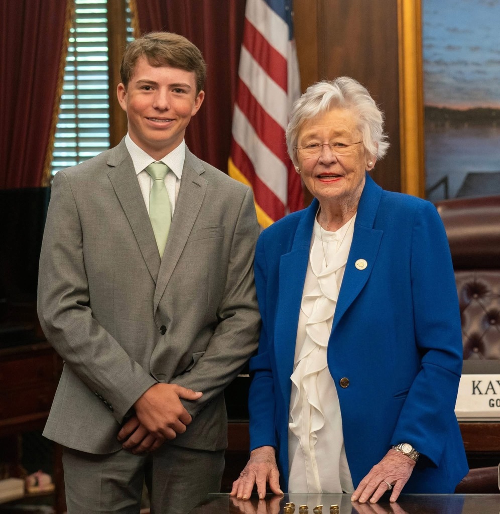 Jace with Governor Ivey