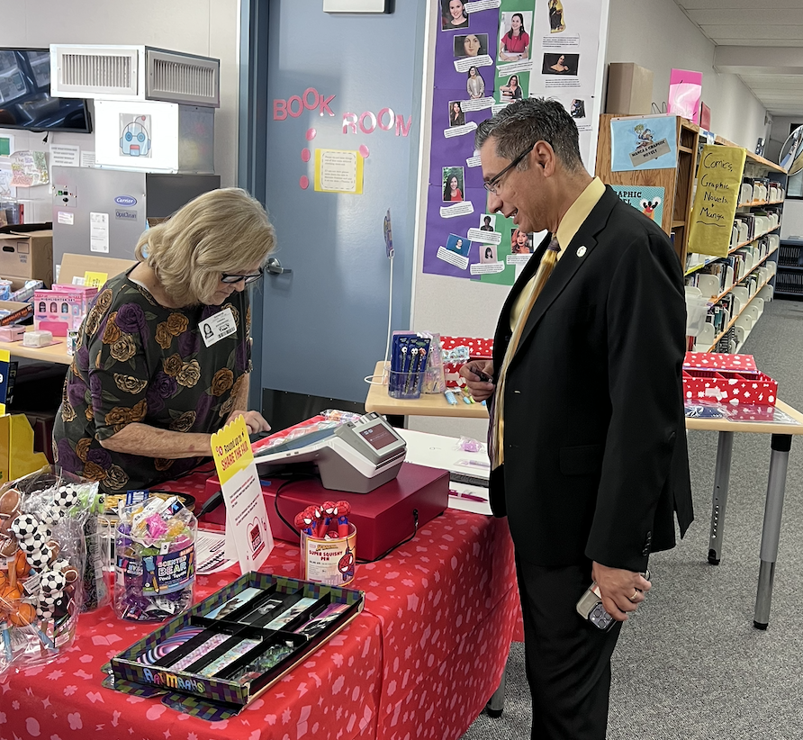 Dr. Ibarra purchasing books at our PTSA Book Fair. 