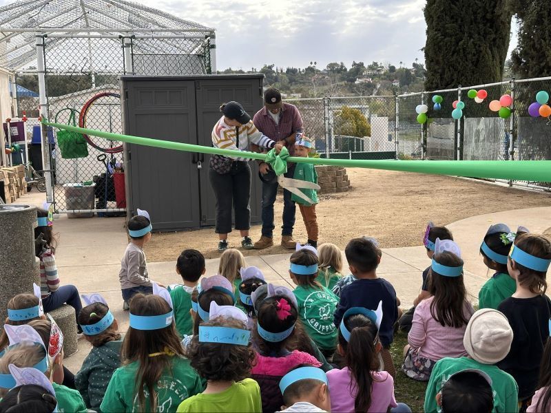 Students watch a ribbon-cutting at L. R. Green School.
