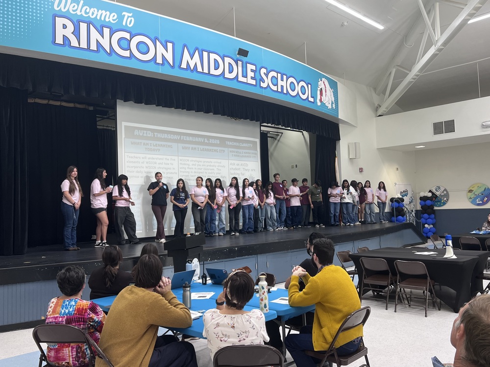 AVID students leading Staff Meeting 