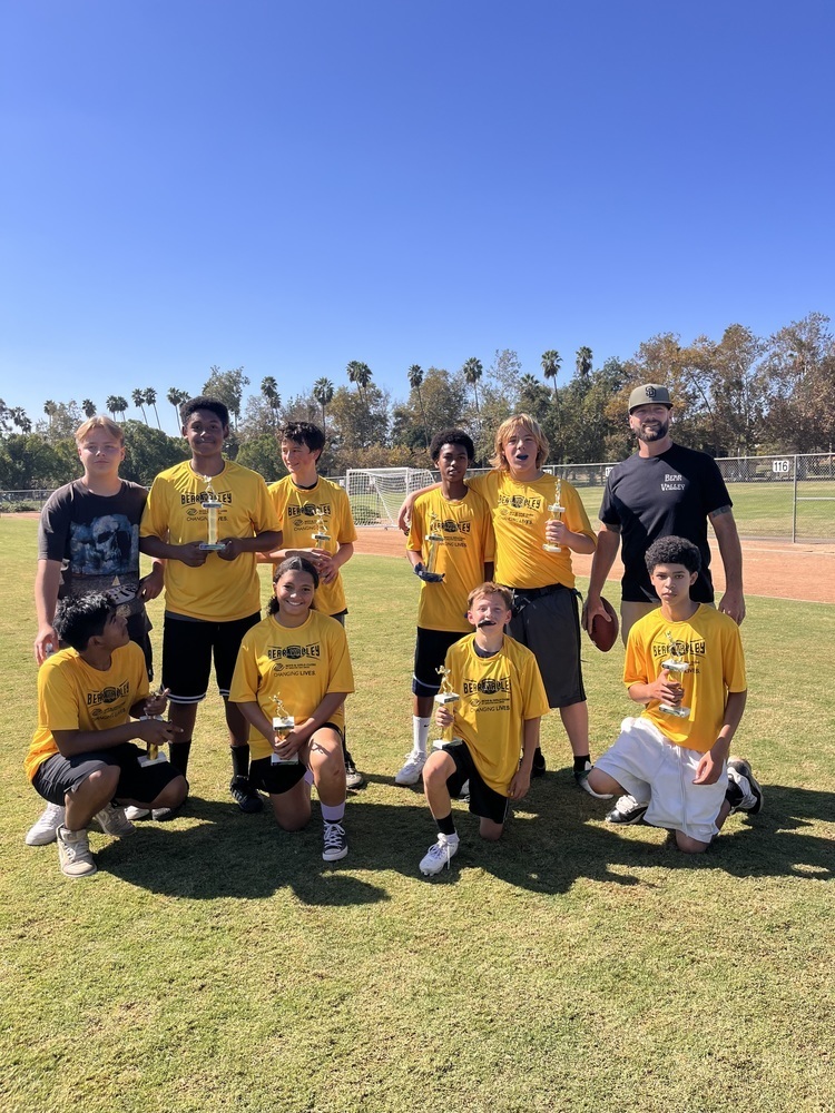 football team holding trophies