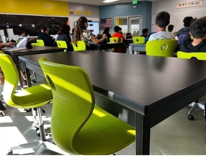 A classroom of students working.